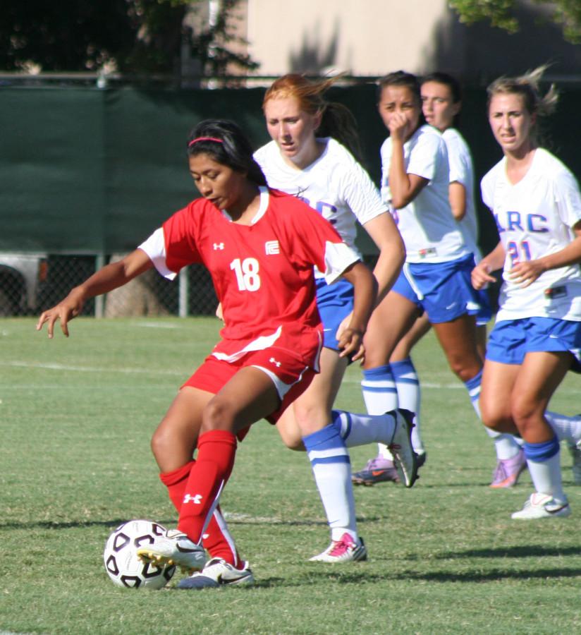 Fresno City College players vie for a loose ball.