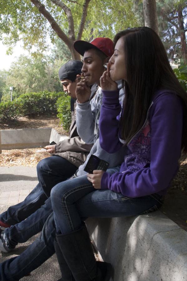 Students smoke on campus, October 20, 2010. 