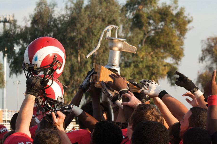 FCC football players celebrate with the pump after their 48-13 win over Reedley College