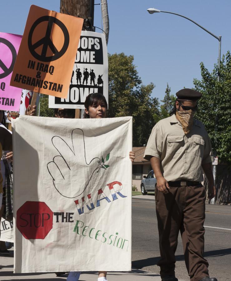 Fresno City College student Adriana Martinez leads the March in Southeast Fresno