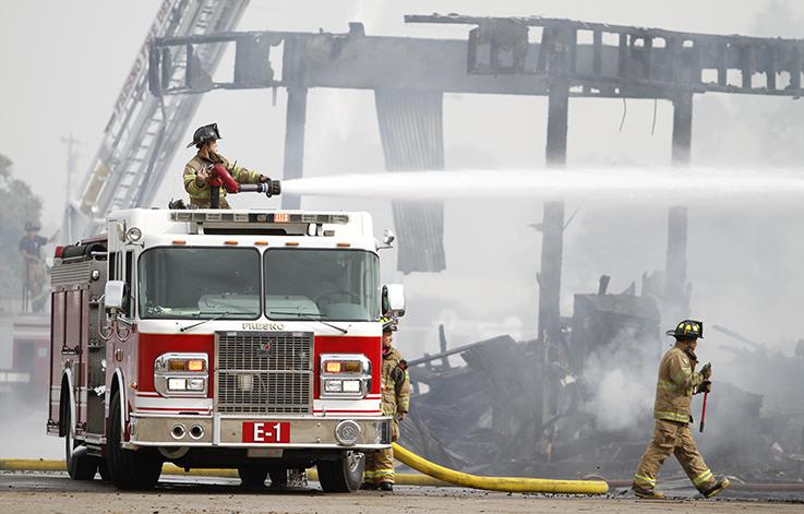 Massive industrial fire damages residential homes