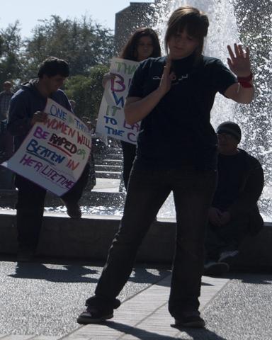 Photo by Karen West. Amber Olmo, organizer begins the flash mob protesting violence against women on Feb. 14.