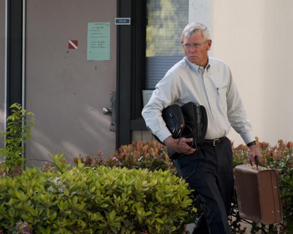 Photo By Karen West. Dr. Brian Calhoun exits his office after cleaning it out on April 1, 2013.