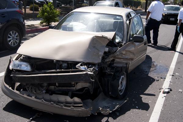 The driver, who refused to give his name, ran into another vehicle that was stopped for pedestrians to cross the street at McKinley in front of Fresno City College on April 22, 2013. (Photo/Karen West)