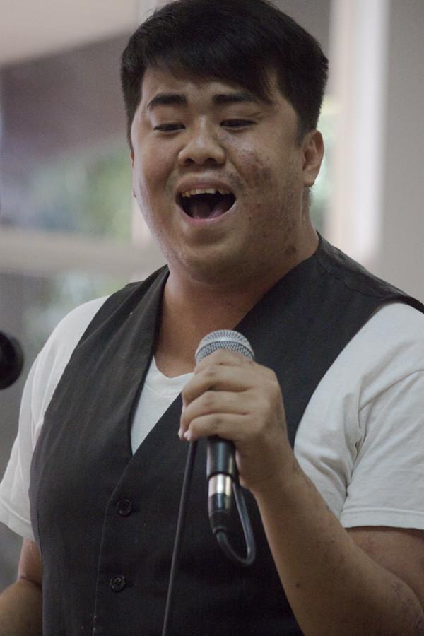 Yang Fang of the Hmong American Student Association sings, Hallelujah  at the Asian Club Showdown held on April 25, 2013 in the Fresno City College Student Lounge in celebration of Asian American Month. (Photo/Darlene Wendels)