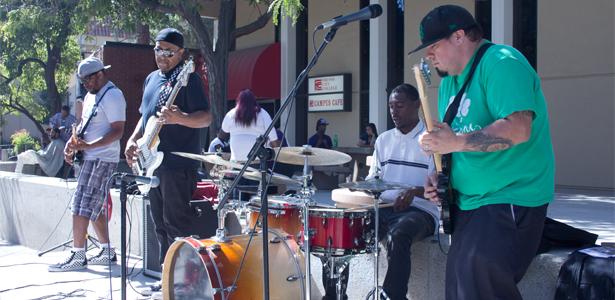 DB & the Struggle, a reggae-themed cover band made up of bassist Black Fry, farthest left, guitarist Ty Stick Baby, drummer James Elliott and Carlos DB Montana, farthest right, performing at Fresno City Colleges Free Speech Area on Friday, Oct. 4, 2013.  Photo/Kevynn Gomez