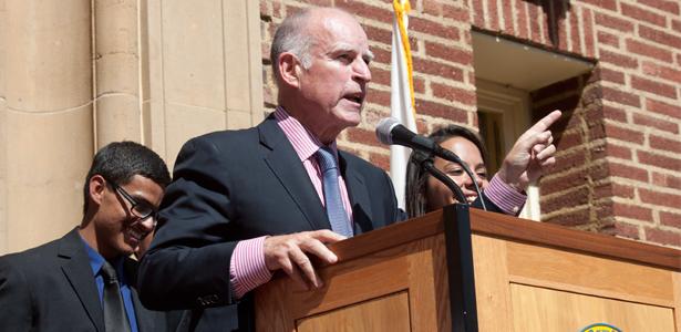Gov. Jerry Brown gives a speech on the steps of the Old Administration Building at Fresno City College on Thursday, Oct. 3, 2013, prior to signing AB60, a law that will allow residents with an illegal status to obtain drivers licences in California beginning in 2015.