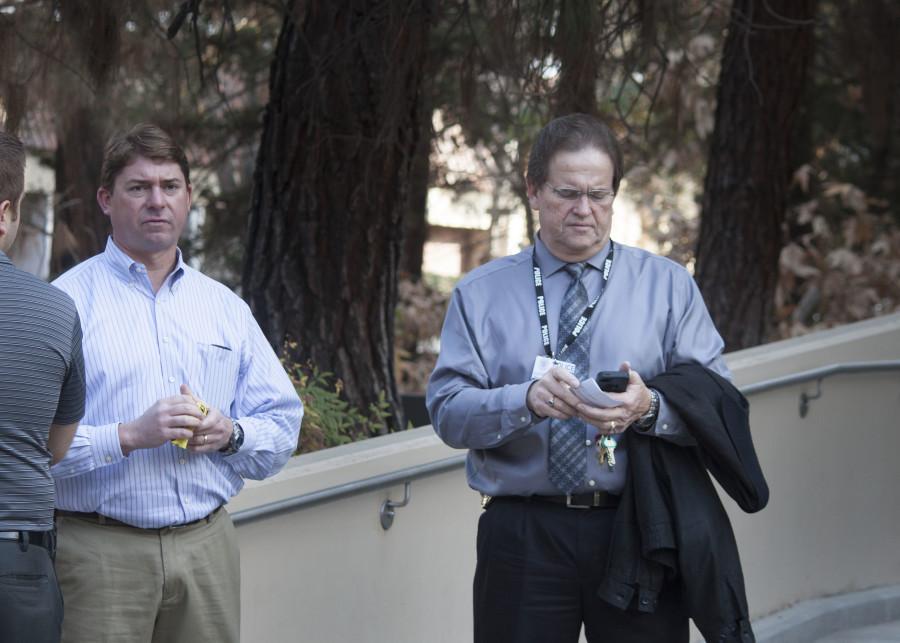 (Left) SCCCD Director of Environmental Health and Saftey Darren Cousineau, and SCCCD Police Chief Bruce Hartman stand at an entry way to the Math/Science building after announcing that it will be closed for the rest of the day due to a potential bomb threat recieved Wednesday, Jan. 22, 2014. Classes in the building will resume Thursday, Jan. 23, 2014. Photo by Darlene Wendels/The Rampage