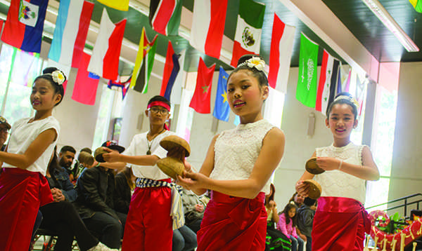 The Laos-American Community of Fresno Dancers performing during Asian Fest on Saturday, April 25, 2015 in the cafeteria on Fresno City College. Asian Fest featured many different performances from that reflect the diversity of cultures in Asia. 