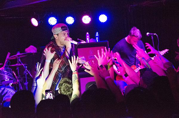 The crowd reaches out to vocalist Garret Rapp of The Color Morale. Wednesday, April 1, 2015. 