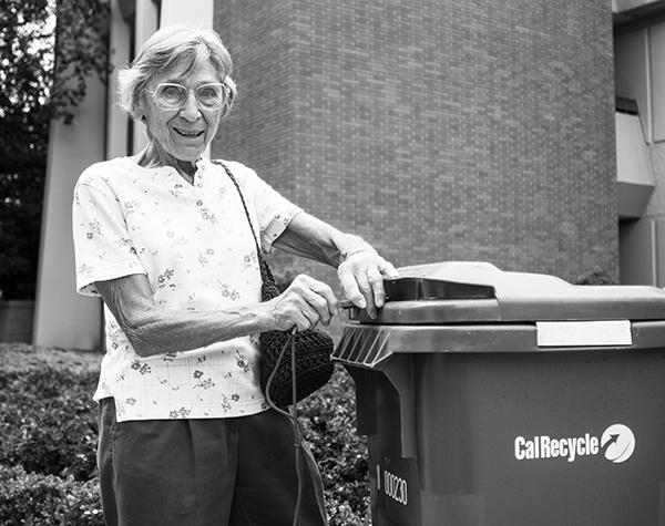 Dorothy Sedley unlocks one of the bins from which she collects recyclables on campus in order to donate money to the State Center Community College Foundation. 