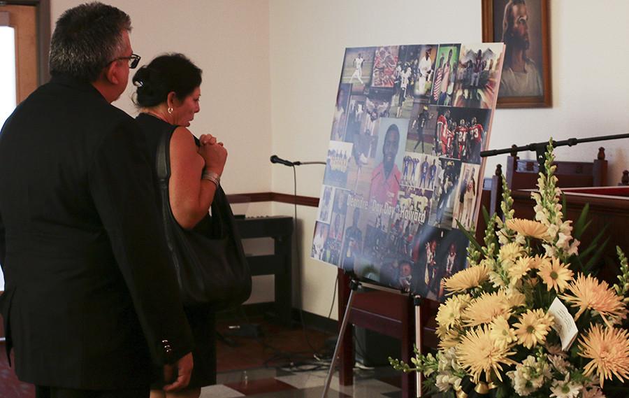 Fresno City College’s Interim President Dr. Cynthia Azari  and Vice President of Student Services, Dr. Chris Villa pay respect to Deondre Howard on Friday, Sept. 4, 2015. 