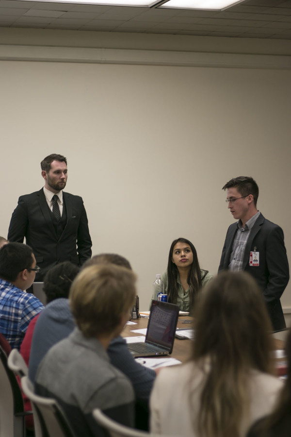 Legislative Vice President Travis C. and ASG Trustee, Cody T. Sedano speaking on student issues.