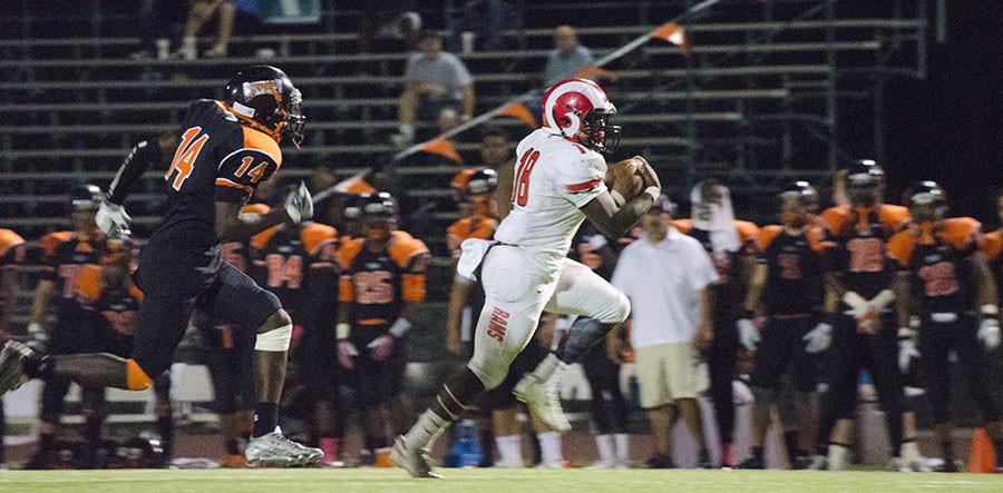 Nate Jones, running back for the Fresno City College football team, dashes to make the touchdown with Reedley right behind him. Saturday, Oct. 3, 2015. 