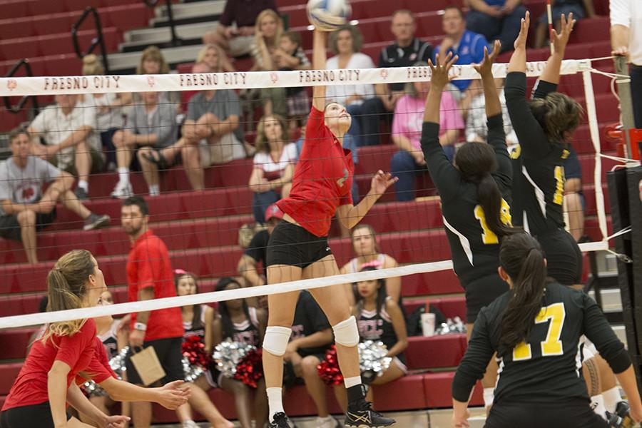 Freshman middle blocker Sydney Molander hits the ball over the net versus Taft, Wednesday Oct. 14 at FCC Gymnasium. 