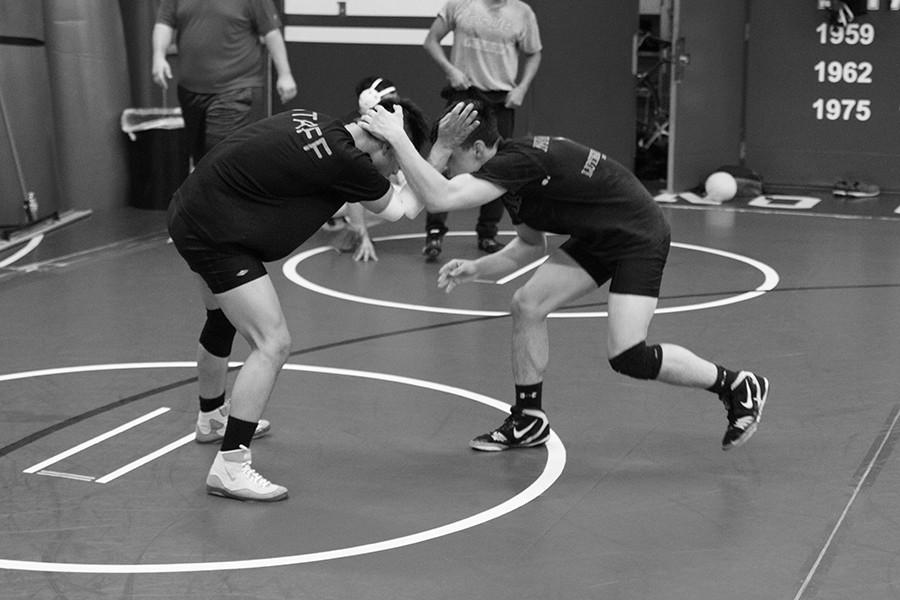 Sophomores Adrian Camposano and Albert Rosas in a clinch at  practice in the FCC Wrestling Room, Thursday Nov. 12, 2015. 