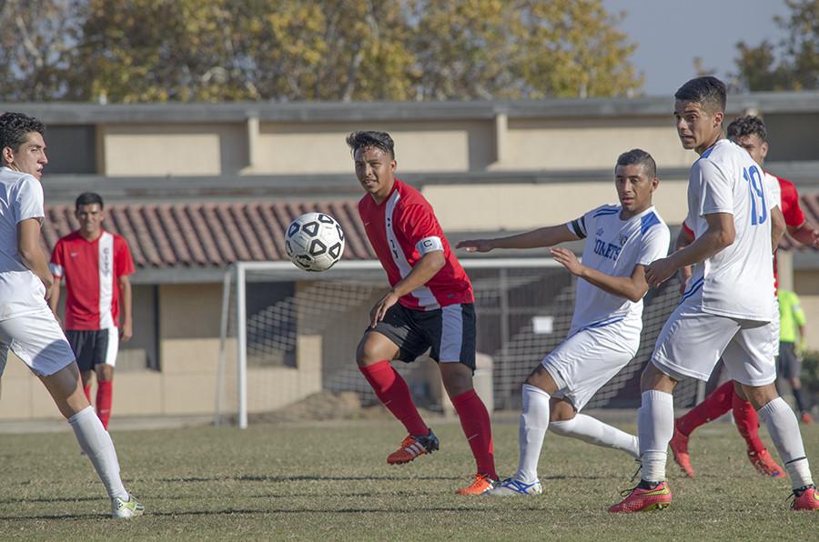 Fresno City College Captain Sergio Segura finds an opening between the Solano defense, at Ratcliffe Sadium, Saturday, Nov. 21, 2015. 