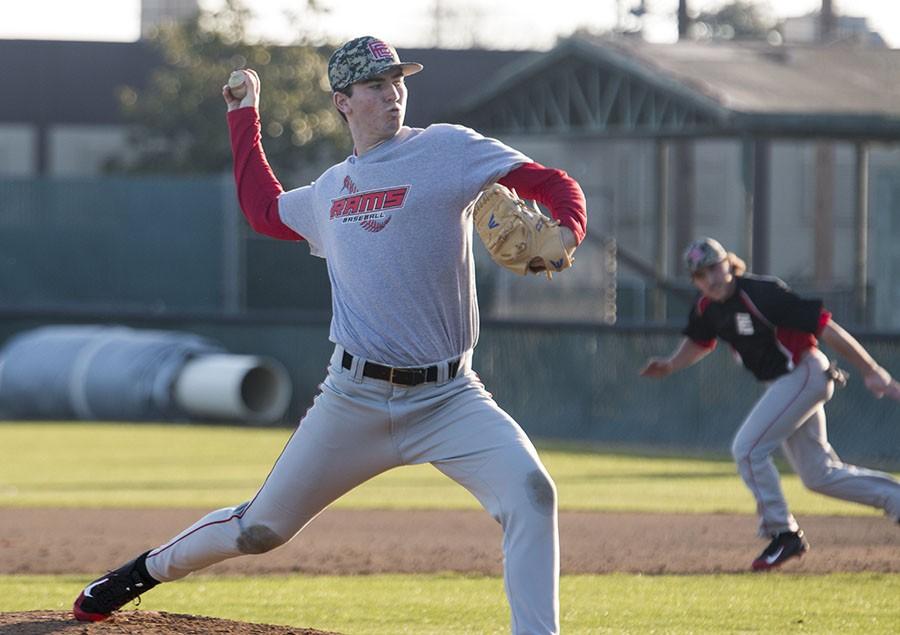 Freshman Mat Walker practices pitching at Ratcliffe Stadium on Tuesday Jan. 26, 2016.