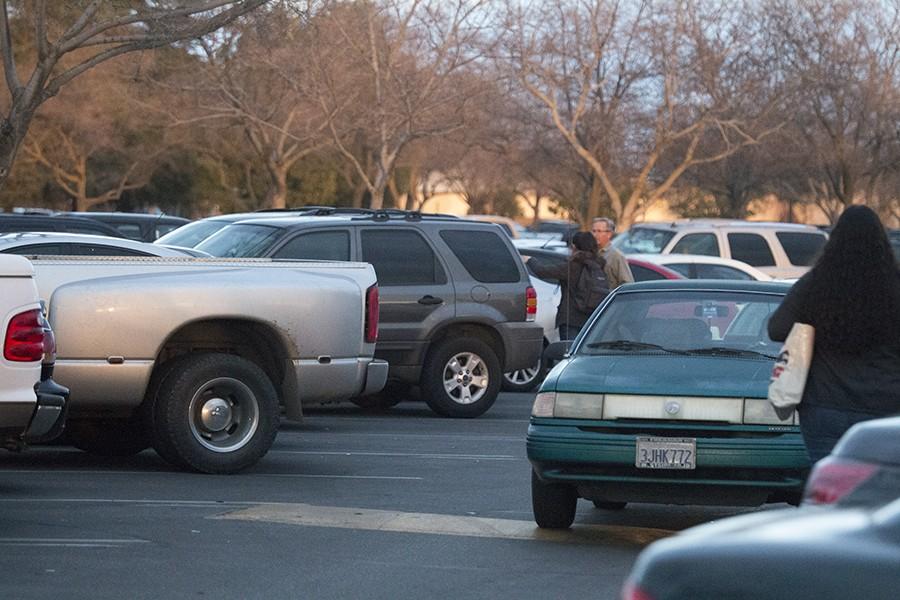 Students struggling to find a place to park at the Fresno City College parking lot D on Monday Jan.26, 2016. 