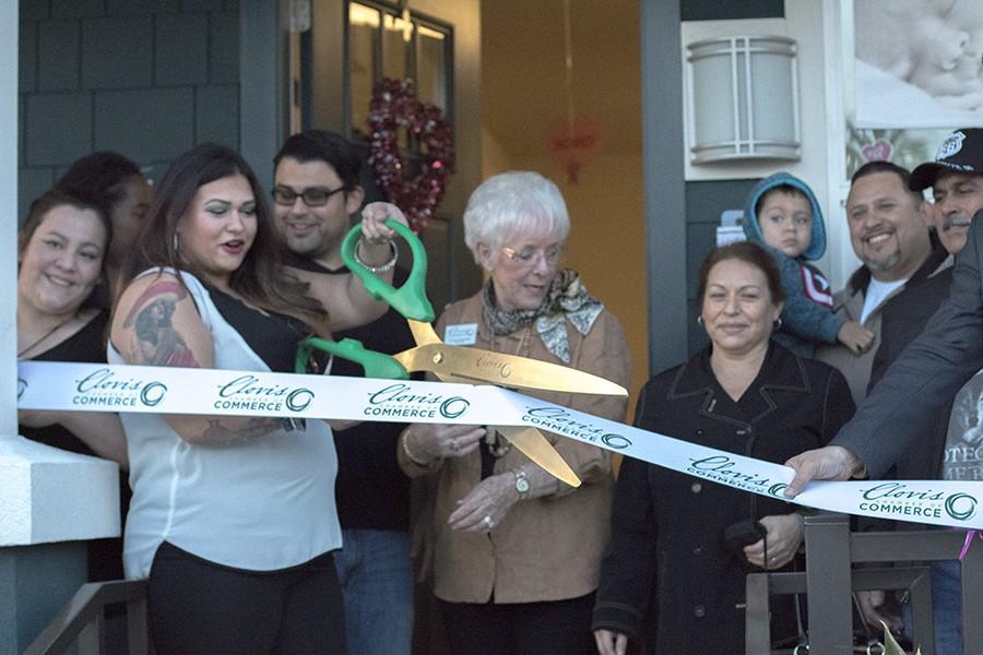 Isabel Orduno cuts the ribbon at her new photo studio, Isabel Orduno Photography located in Downtown Fresno on Thursday Feb. 4, 2016. 