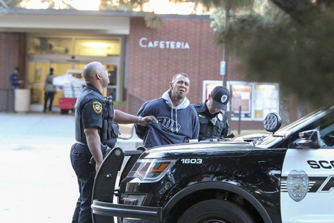 Fresno City College Police officers apprehend burglary suspect in front of Pacific Cafe on Friday Feb. 19, 2016. Larry Valenzuela/ Photo