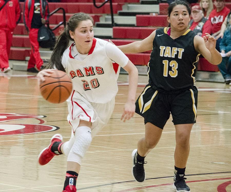 Julia Cuellar, guard for Fresno City College, maneuvers away from forward Amber Vaughn from Taft College. Saturday, Feb. 6, 2016. Photo/Daisy Rodriguez