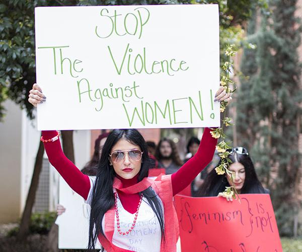 Jennifer Dorain leads a Women's Day march from the Library to the Free Speach area on Mar. 3, 2016.