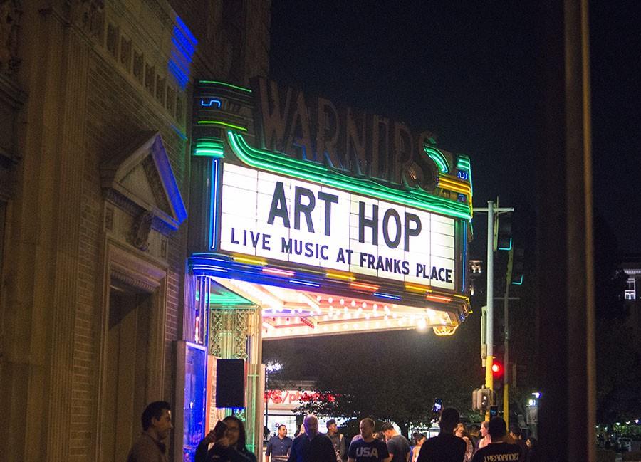 ArtHop attendees walk in front of Warnors Theatre, one of the ArtHop locations on Thursday, March 3, 2016. ArtHop happens on the first and third Thursdays of the month and have venues in the Tower District, Downtown Fresno and Clovis. 