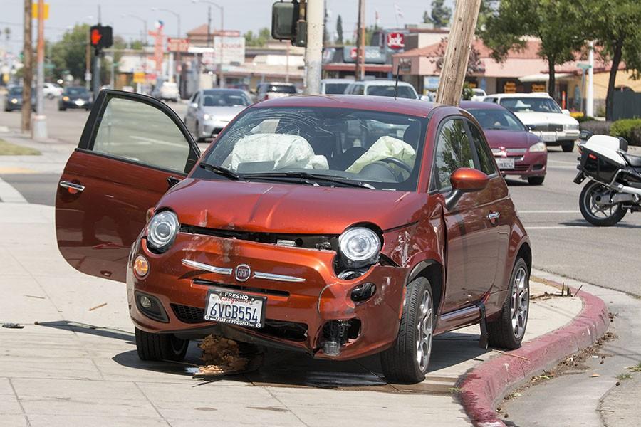 Vehicle accident leaves tiny car totaled near Fresno City College [PHOTOS]