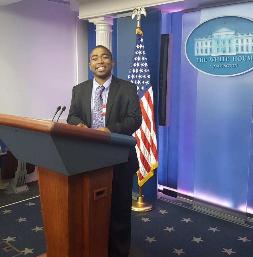 Patrick Forrest stands behind a podium before a news briefing by the White House Press Secretary, Josh Earnest at the White House College Reporter Day on April 28, 2016. U.S. President Obama also made an appearance during the briefing. 