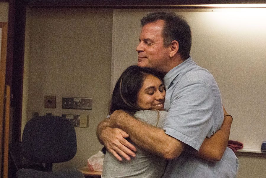 Eric Field, survivor of the Sept. 11, 2001 attacks on the World Trade Center in New York, hugs a student during a speech at Fresno City College.