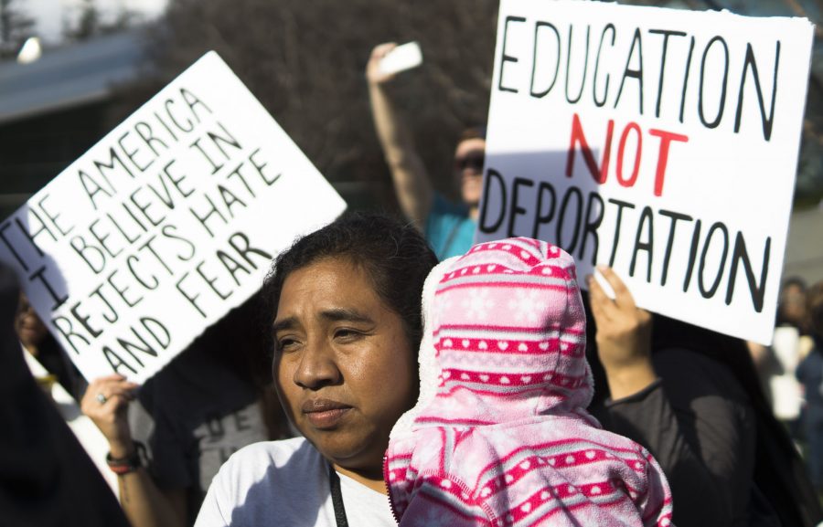 Monica+Lopez+and+her+daughter%2C+Ruby%2C+look+onto+the+crowd+of+protesters+at+Fresno+City+Hall+for+the+Sanctuary+for+All+Solidarity+March+that+went+through+downtown+Fresno+on+Saturday%2C+Feb.+18%2C+2017.