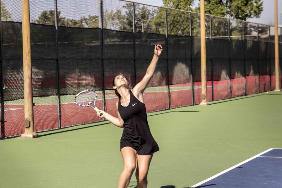 Kristen Clore sets up serve against Modesto on  April 4, 2017. Photo/Eric Jaramishian 