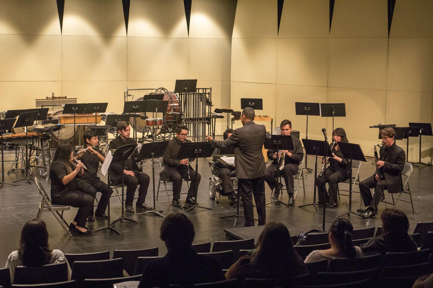 Larry Honda conducts woodwind ensemble for the Spring Concert on April 25, 2017.