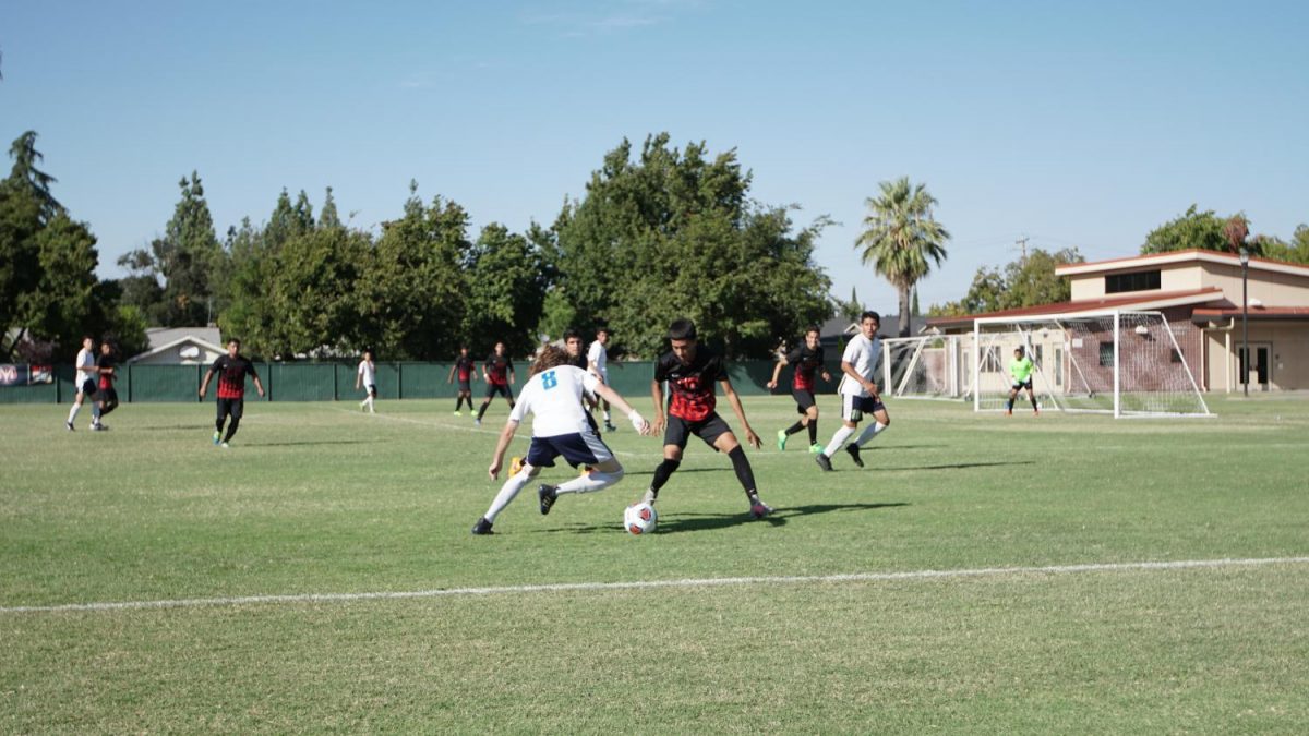 Fresno City College defender, right, maintains his position during a home game against Clovis Community College on Tuesday, Sept. 26, 2017.