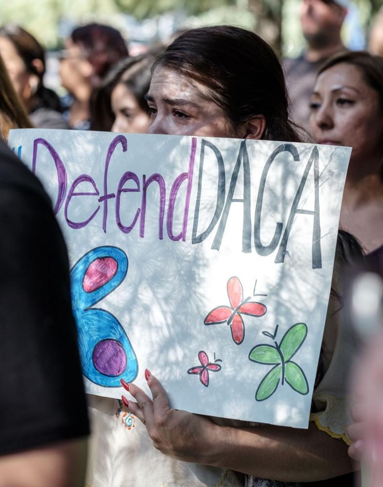 Anacecilia Tover, a DACA recepient, tears up during the "Stand Up for DACA" protest in front of the federal courthouse in downtown Fresno on Tuesday, Sept. 5, 2017.