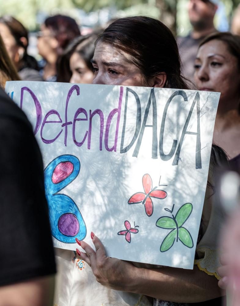 Anacecilia Tover, a DACA recepient, tears up during the Stand Up for DACA protest in front of the federal courthouse in downtown Fresno on Tuesday, Sept. 5, 2017.