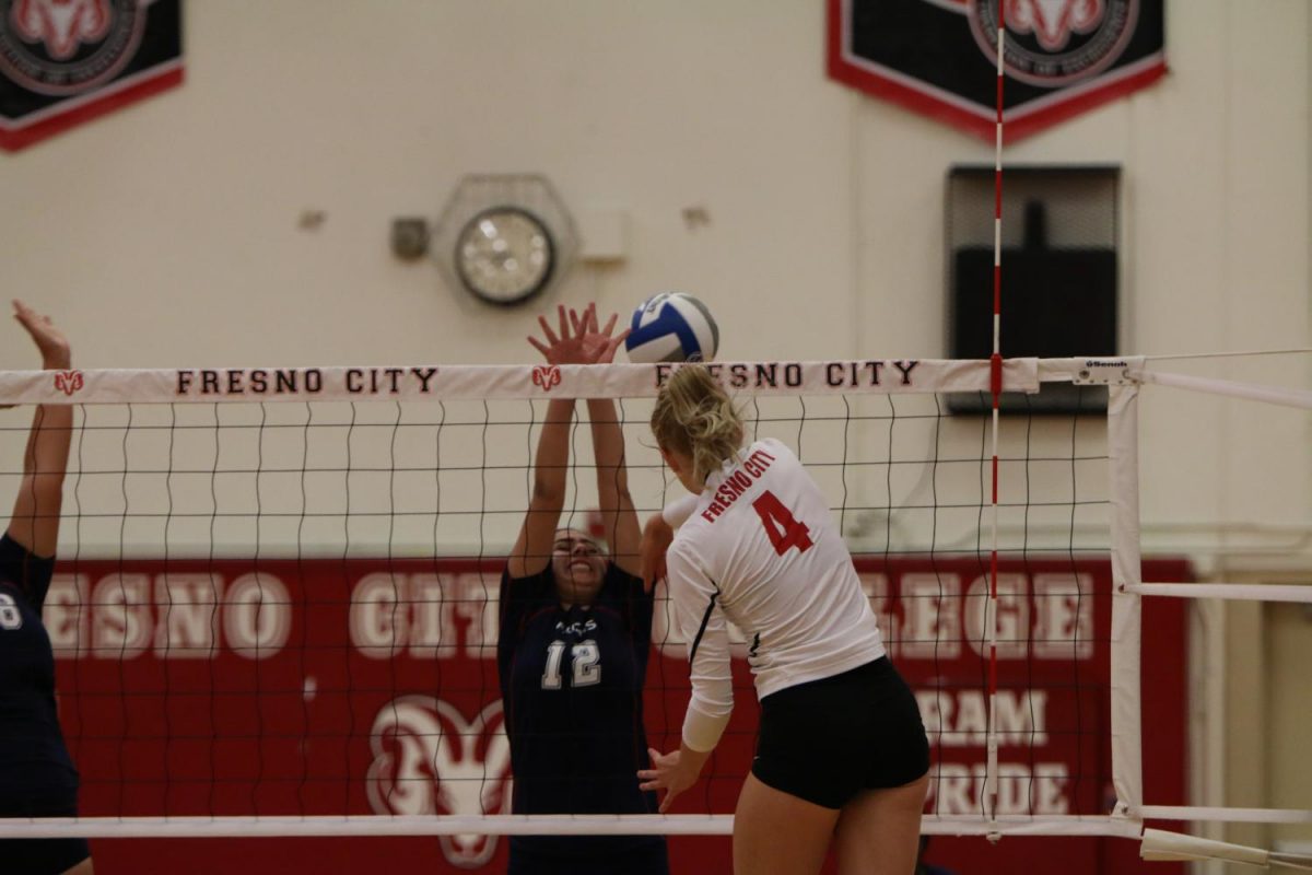 Fresno+City+College+right+side+hitter+Mia+Corippo+is+spiking+the+ball+in+front+of+a+West+Hills+player+during+the+Sept.+20%2C+home+game.