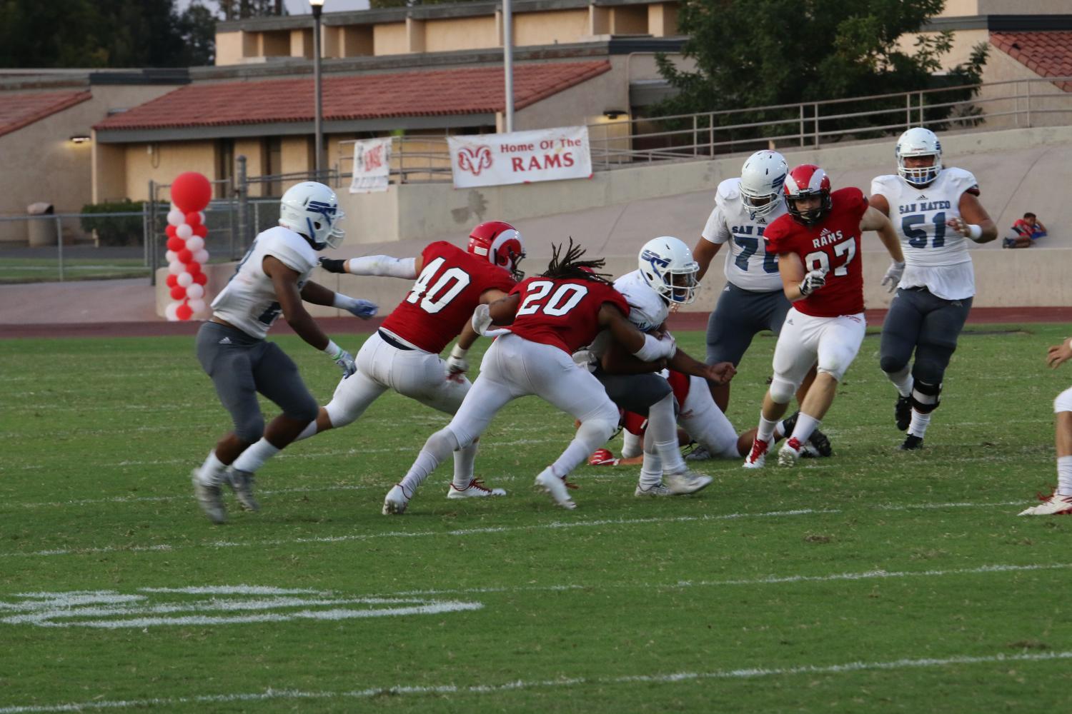 Fresno City College linebackers Logan Fogg and DJ Morgan make tackle on College of San Mateo defender during Sept. 16 home game loss.