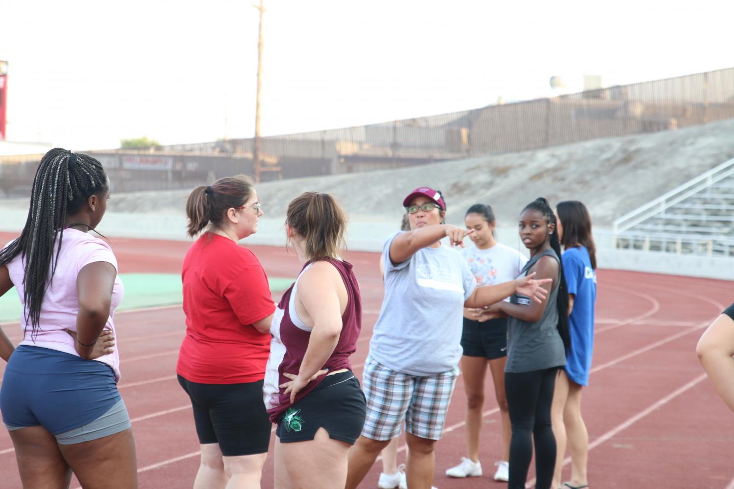 Coach Hope Villines instructs FCCs new cheer team during practice at Ratcliff Stadium.