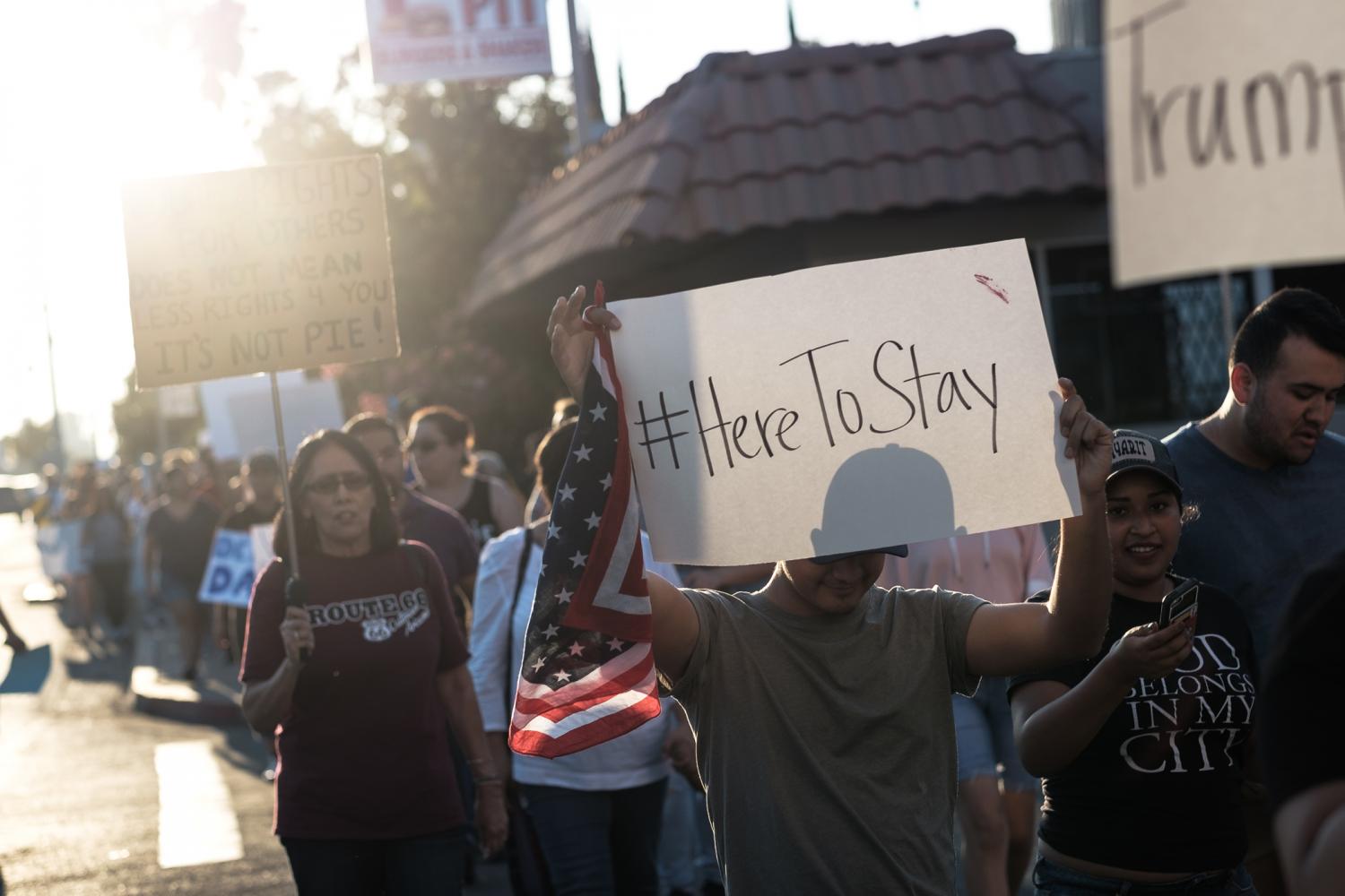 Protesters march down Olive avenue through Fresnos Tower District during the March for DACA on Sunday, Sept. 15, 2017.