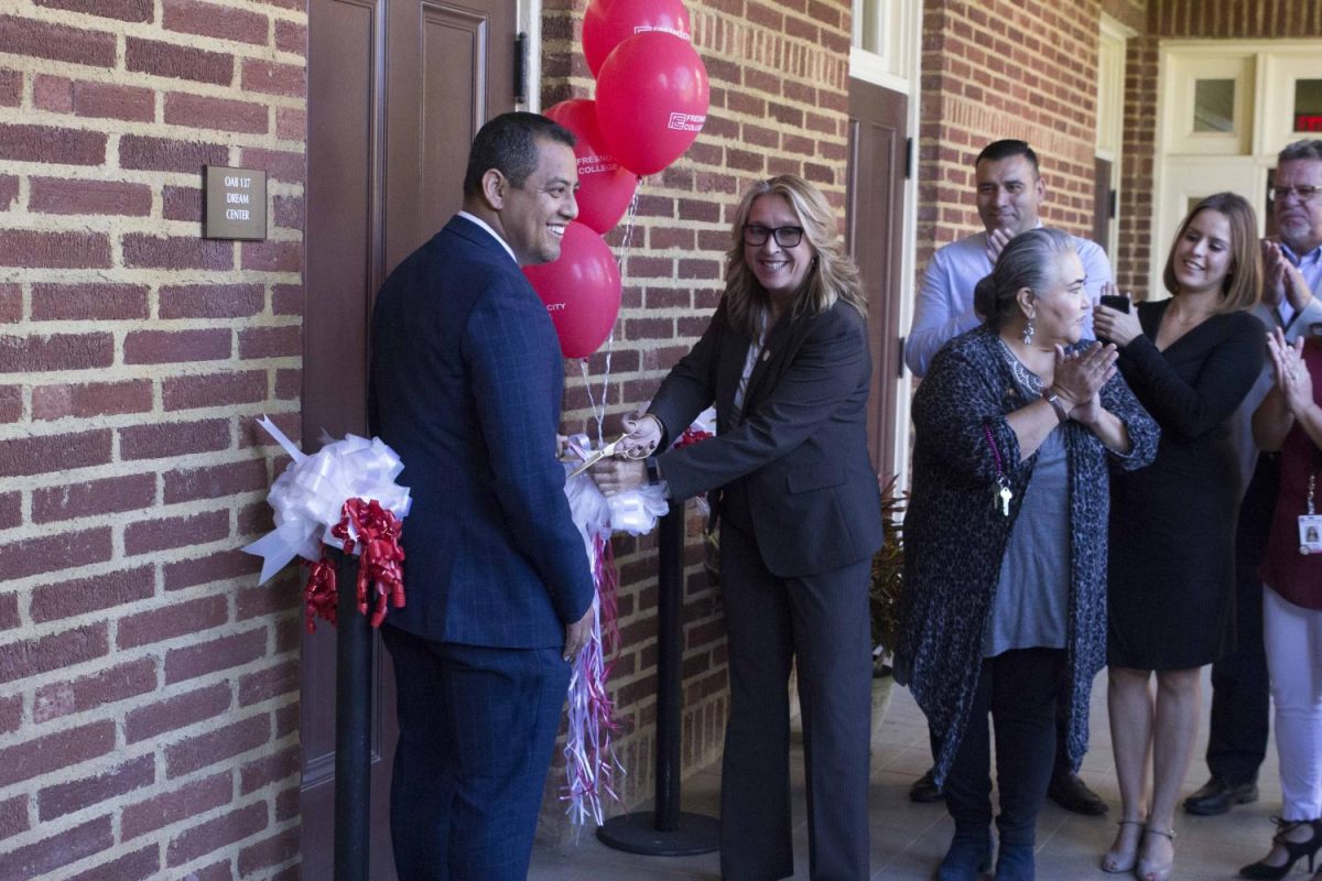 From left: SCCCD Trustee Miguel Arias, FCC President Carole Goldsmith and Dream Center counselors cut the ribbon to officially open the Dream Center in OAB 137 on Thursday, Sept. 21, 2017.