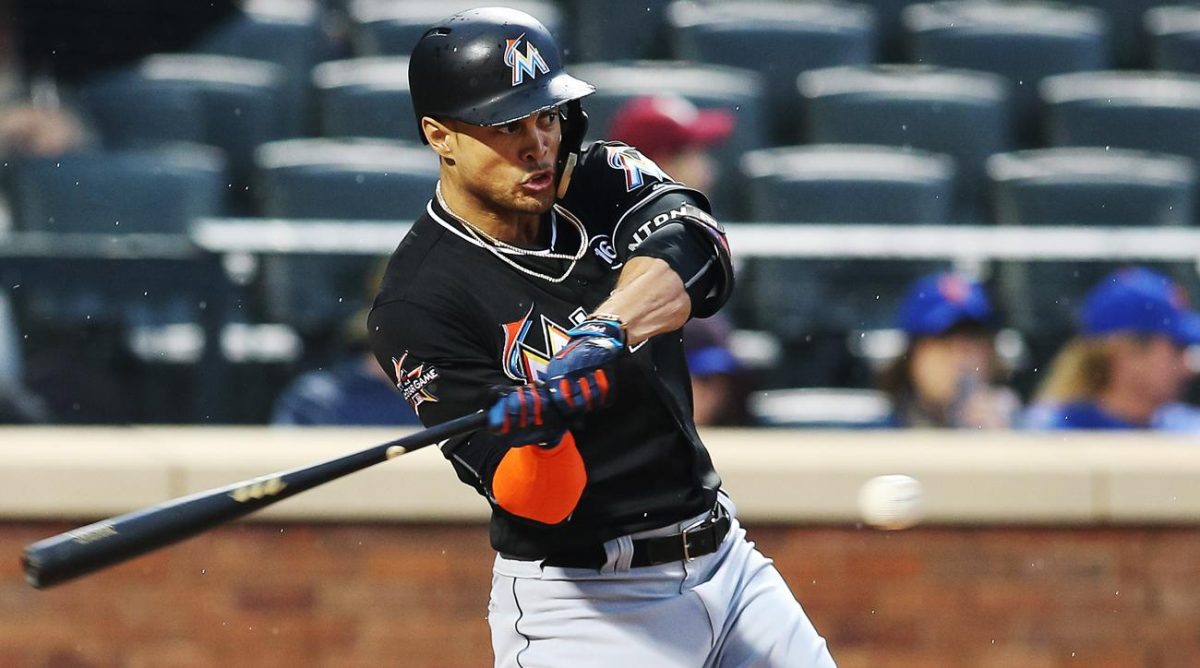 Miami Marlins outfielder Giancarlo Stanton swinging at the ball.