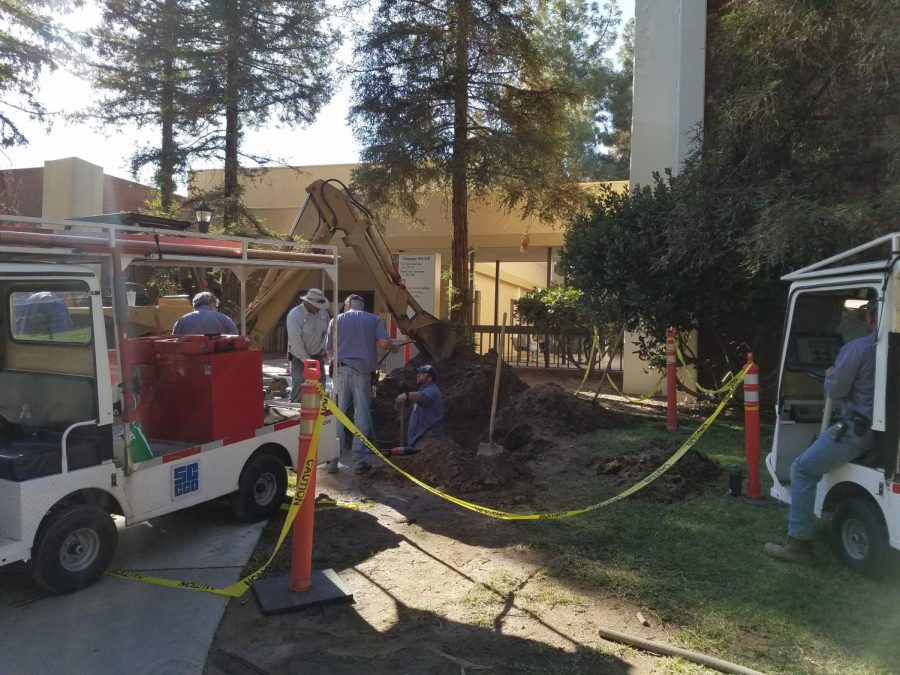Maintenance crews work on a chilled water line leak near the Language Arts building at Fresno City College on Wednesday, Oct. 25, 2017.