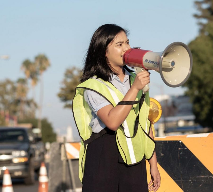 Sophia Bautista speaks to the crowd during a protest she organized in Fresno’s Tower District on Sunday, Sept. 17, 2017.