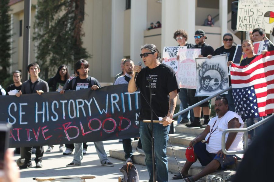 American-Indian studies instructor Bernard Navarro speaks at FCCs main fountain stage about the Native American communitys thoughts about Columbus Day on Monday, Oct. 9, 2017.