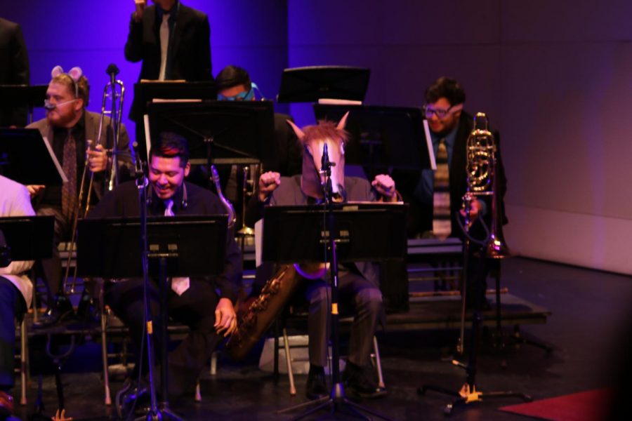 Baritone saxophone player Blake McAllister dons a horse head costume during the FCC jazz ensemble performance on Oct. 18, 2017