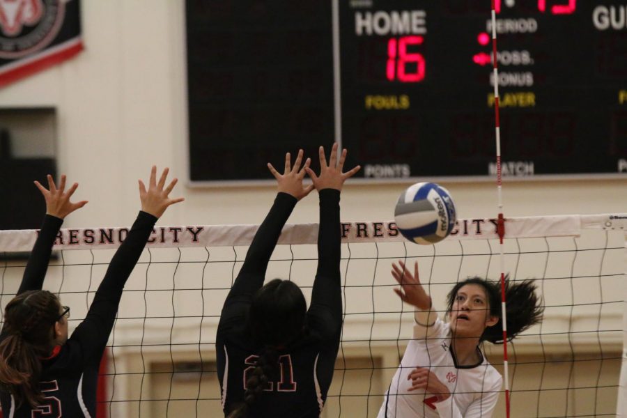 Fresno City College outside hitter Makayla Cervantes gets the ball pass an opponents block during a home match against Porterville College on Friday, Nov. 10, 2017.