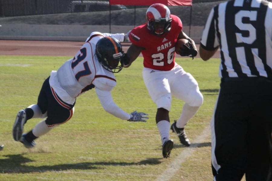 Fresno City College running back Isaiah Hilliard stiff-arms an opponent during a home game at Ratcliff stadium on Saturday, Nov. 11, 2017.