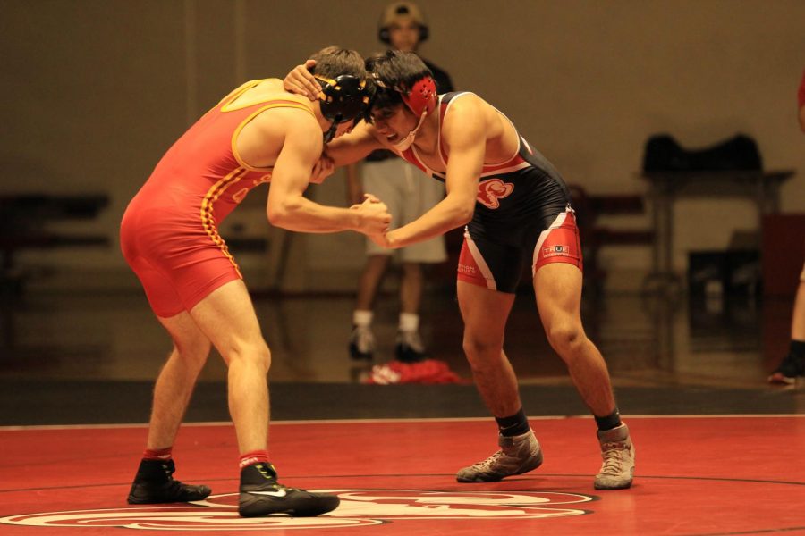 Fresno City College 125 pound wrestler Jacob Delgado locks up with his opponent from Skyline College during a recent dual meet at home on Saturday, Oct. 28, 2017.